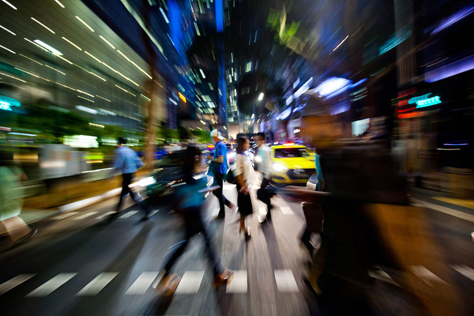 Pedestrians in Raffles Place in Singapore. A RAND survey found that Singaporeans have greater expectations of carrying on work after retirement age. (Photo: Getty Images/Bloomberg)