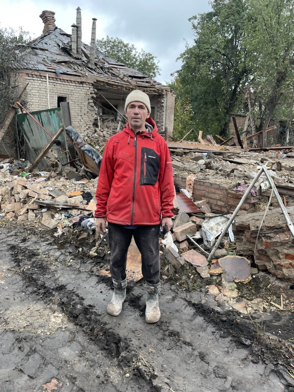 Vladimir Chumak outside the rubble of his house in Slovyansk after a Russian missile attack in which his sister-in-law Zoya was killed (Slovyansk city mayor’s office/Supplied)