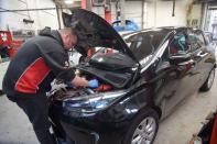 Tom runs diagnostics on a fully electric Renault Zoe, in High Wycombe