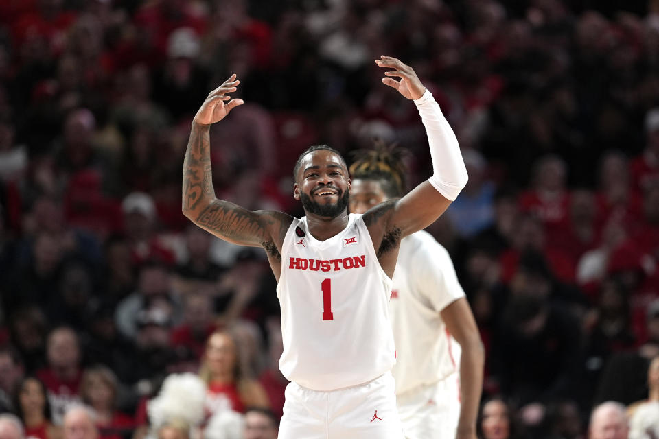 Houston's Jamal Shead (1) encourages the crowd during the second half of an NCAA college basketball game against Texas Tech Wednesday, Jan. 17, 2024, in Houston. Houston won 77-54. (AP Photo/David J. Phillip)