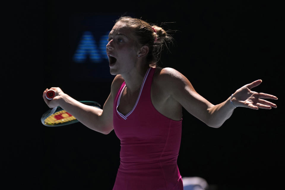 Marta Kostyuk of Ukraine reacts during her quarterfinal match against Coco Gauff of the U.S. at the Australian Open tennis championships at Melbourne Park, Melbourne, Australia, Tuesday, Jan. 23, 2024. (AP Photo/Alessandra Tarantino)