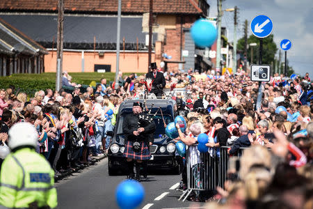 Football fans and wellwishers gather ahead of the funeral of Bradley Lowery, in Blackhall Colliery, Britain July 14, 2017. REUTERS/Mary Turner