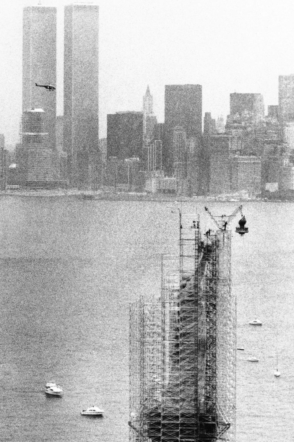 FILE - This July 4,1984 file photo shows the original torch of the Statue of Liberty after it was removed from her grasp, in New York. The torch, which was replaced by a replica, was moved into what will become its permanent home at a new museum on Liberty Island. (AP Photo/David Pickoff, File)