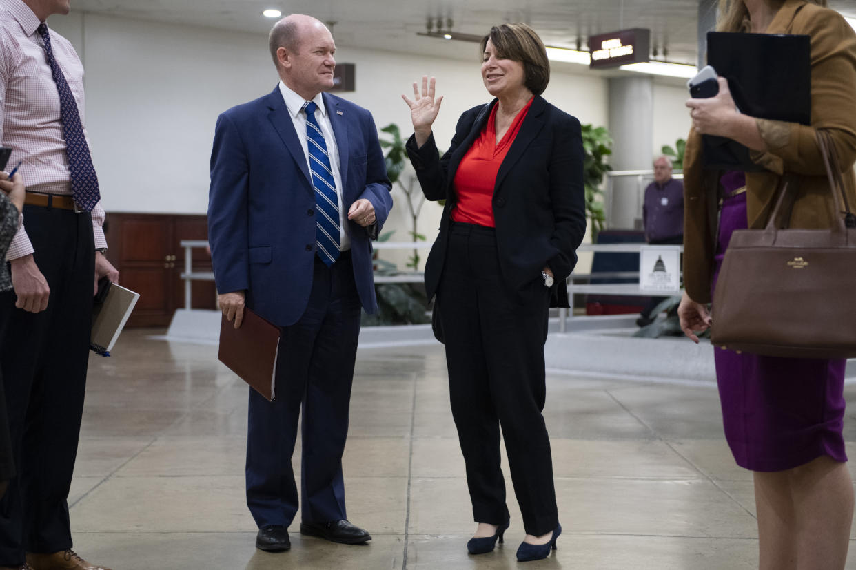 UNITED STATES - OCTOBER 22: Sen. Amy Klobuchar, D-Minn., and Sen. Chris Coons, D-Del., are seen in the Capitols Senate subway on Tuesday, October 22, 2019. (Photo By Tom Williams/CQ-Roll Call, Inc via Getty Images),