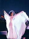 <div class="caption-credit"> Photo by: Getty Images</div>Taking flight on stage in 1991 <br> A white sequined bodice with a semi-sheer chiffon skirt and cape provide a major ethereal vibe.