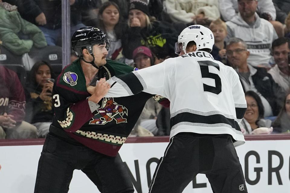 Kings defenseman Andreas Englund and Arizona Coyotes defenseman Josh Brown fight during a game Monday in Tempe, Ariz.