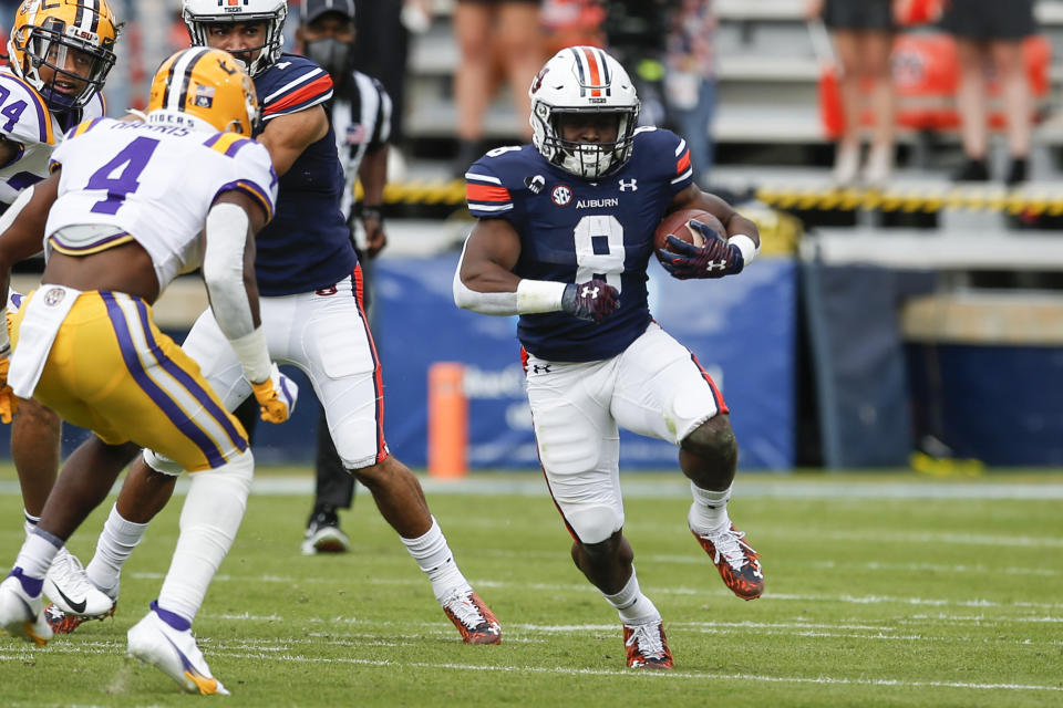 Auburn running back Shaun Shivers (8) carries the ball during the first quarter of an NCAA college football game against LSU on Saturday, Oct. 31, 2020, in Auburn, Ala. (AP Photo/Butch Dill)