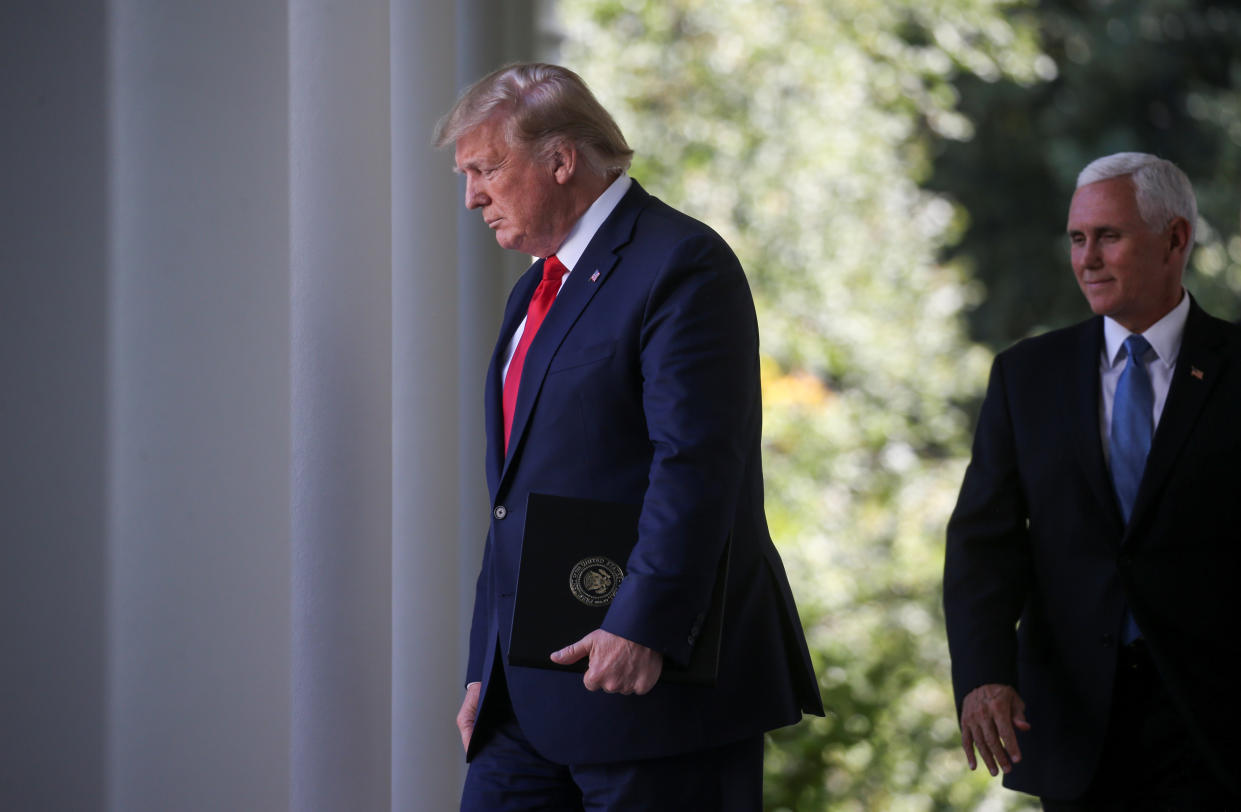 President Trump is followed by Vice President Mike Pence. (Photo: Reuters/Leah Millis)