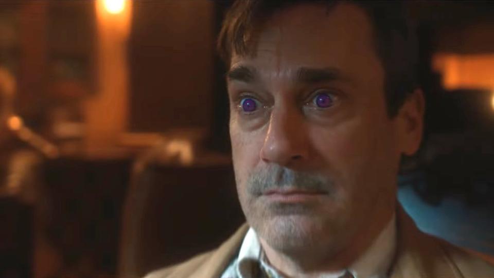 Jon Hamm with purple eyes looks stunned in Good Omens season two