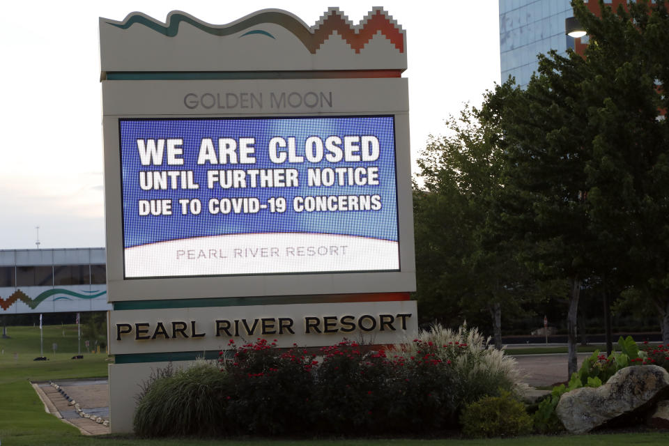 Instead of welcoming visitors to the Pearl River Resort, the marquee outside the Golden Moon Casino and Hotel, informs the public that the gaming venues, their hotels and the water park are closed, Tuesday, July 21, 2020 in Philadelphia, Miss. The seriousness of COVID-19, hits the tribe hard, especially with around 1,000 tribal members having tested positive for the virus, including the tribal chief. More than 70 people have died. (AP Photo/Rogelio V. Solis)