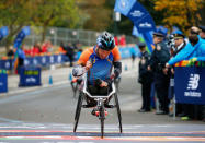 Sho Watanabe of Japan celebrates at the finish line of the New York City Marathon after winning the 3rd place in wheelchair race in Central Park in New York, U.S., November 5, 2017. REUTERS/Brendan McDermid