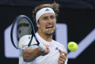 Alexander Zverev of Germany plays a forehand return to Radu Albot of Moldova during their third round match at the Australian Open tennis championships in Melbourne, Australia, Friday, Jan. 21, 2022. (AP Photo/Hamish Blair)