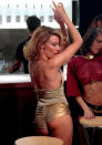 <b>Kylie in the Spinning Around music video, 2000</b><br><br>Arguably the most iconic Kylie image of all time, she revealed her perky rear in this famous pair of gold hotpants for the video for her hit single Spinning Around to kick off the new millennium.