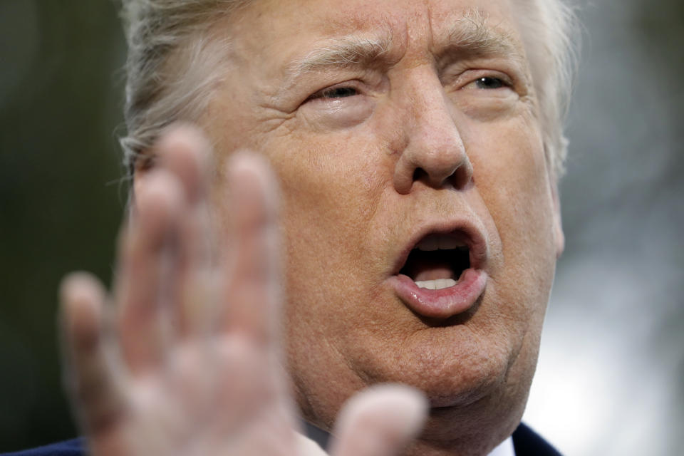 President Donald Trump talks to the media before boarding Marine One on the South Lawn of the White House, Friday, Nov. 9, 2018, in Washington. (AP Photo/Evan Vucci)