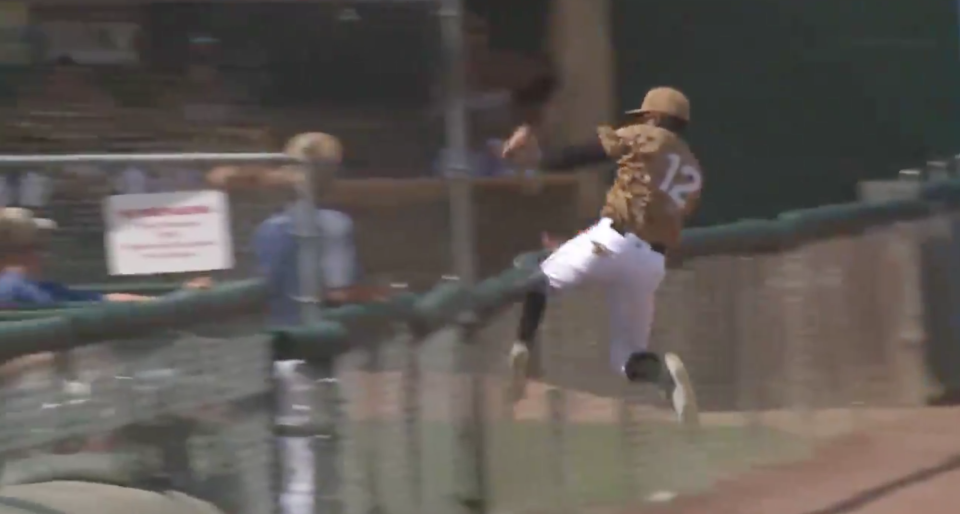 Eric Jenkins goes up and over the left-field foul line fence. (Via @AlexWalkerTV)