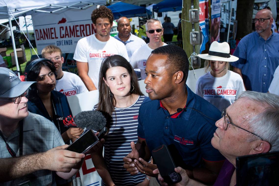 Kentucky Attorney General Daniel Cameron talks with reporters before politicians give speeches during the 142nd annual St. Jeromes Fancy Farm Picnic in Fancy Farm, Ky., Saturday, August 6, 2022.