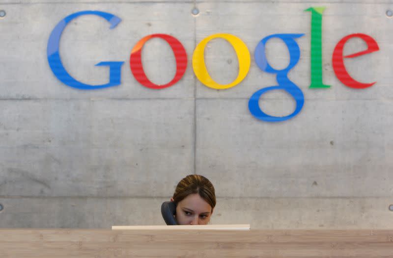 FILE PHOTO: An employee answers phone calls at the switchboard of the Google office in Zurich