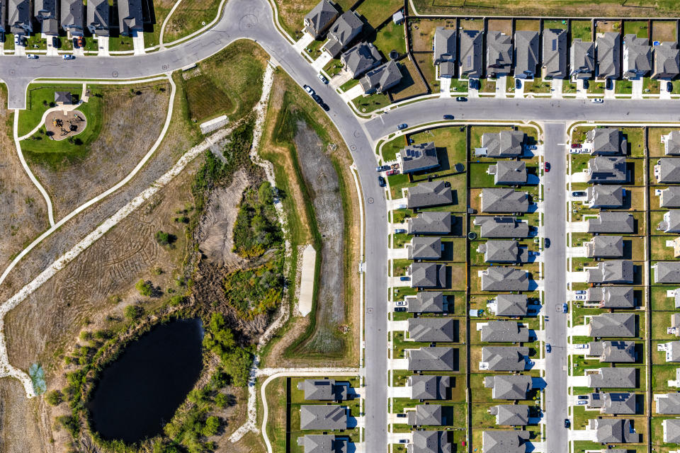 A large master planned, suburban residential development located near Pflugerville, Texas about 20 miles north of downtown Austin shot from an altitude of about 1200 feet on a clear sunny autumn morning.