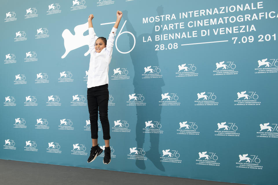 File - Actor Petr Kotlar jumps in the air at a photo call for "The Painted Bird' during the Venice Film Festival. The 77th Venice Film Festival will kick off on Wednesday, Sept. 2, 2020, but this year's edition will be unlike any others. Coronavirus restrictions will mean fewer Hollywood stars, no crowds interacting with actors and other virus safeguards will be deployed. (Photo by Arthur Mola/Invision/AP, File)