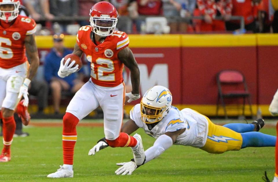 Kansas City Chiefs wide receiver Mecole Hardman Jr. (12) returns a punt as Los Angeles Chargers linebacker Chris Rumph II (94) misses a tackle during an NFL football game at GEHA Field at Arrowhead Stadium on Monday, Oct. 23, 2023, in Kansas City. Tammy Ljungblad/tljungblad@kcstar.com