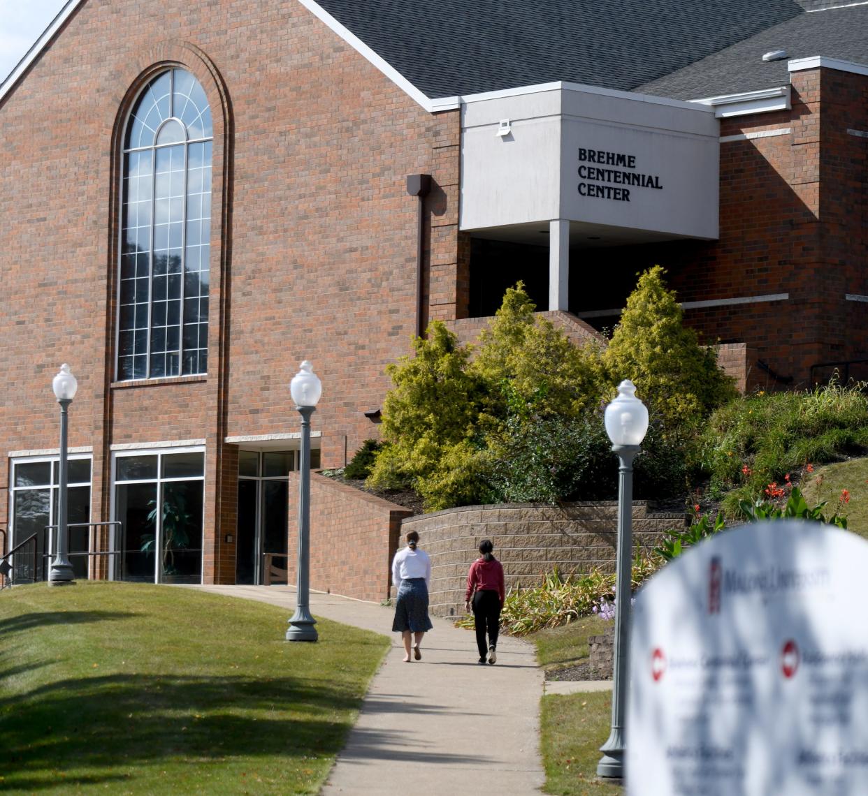 Students walk through campus on a warm fall day at Malone University in Canton. Wednesday, Oct. 4, 2024