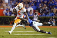 Tennessee quarterback Hendon Hooker (5) can't escape a tackle by Florida linebacker Jeremiah Moon, right, during the second half of an NCAA college football game, Saturday, Sept. 25, 2021, in Gainesville, Fla. (AP Photo/John Raoux)