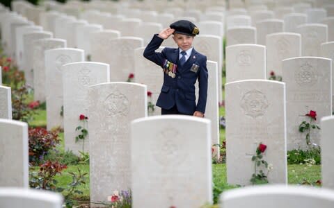 George Sayer pays his respects to his great uncle George Sayer in the Cemetery - Credit: Paul Grover