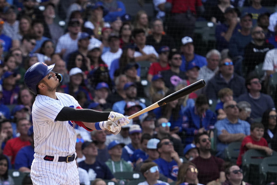 Chicago Cubs' Seiya Suzuki, of Japan, watches as he flies out to Cincinnati Reds left fielder TJ Friedl during the seventh inning of a baseball game in Chicago, Sunday, May 28, 2023. (AP Photo/Nam Y. Huh)