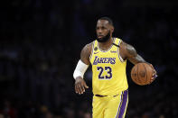 Los Angeles Lakers' LeBron James (23) dribbles during the first half of an NBA basketball game against the Brooklyn Nets Tuesday, March 10, 2020, in Los Angeles. (AP Photo/Marcio Jose Sanchez)