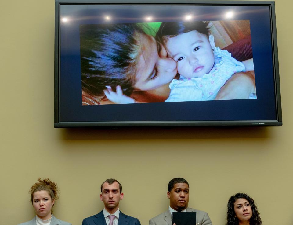 People listen to the story of Yazmin Juárez with Juárez and her daughter Mariee's photo on the screen on July 10, 2019 in Washington.