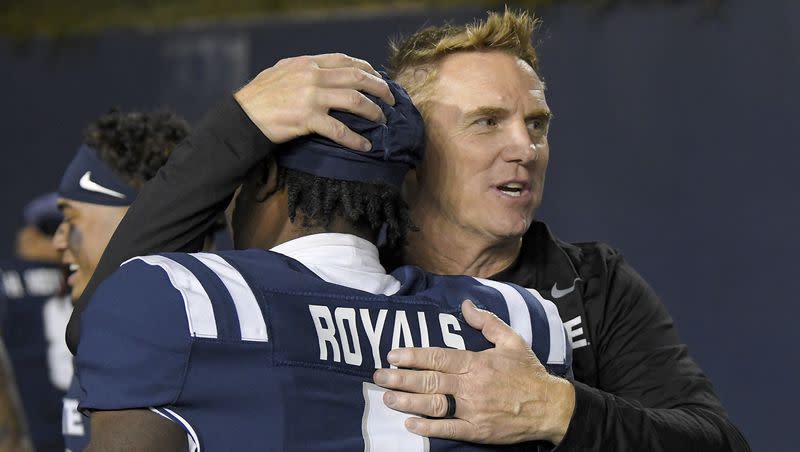 Utah State coach Blake Anderson hugs wide receiver Jalen Royals (1) after the team’s win over Colorado State in NCAA college football game Saturday, Oct. 7, 2023, in Logan, Utah. 