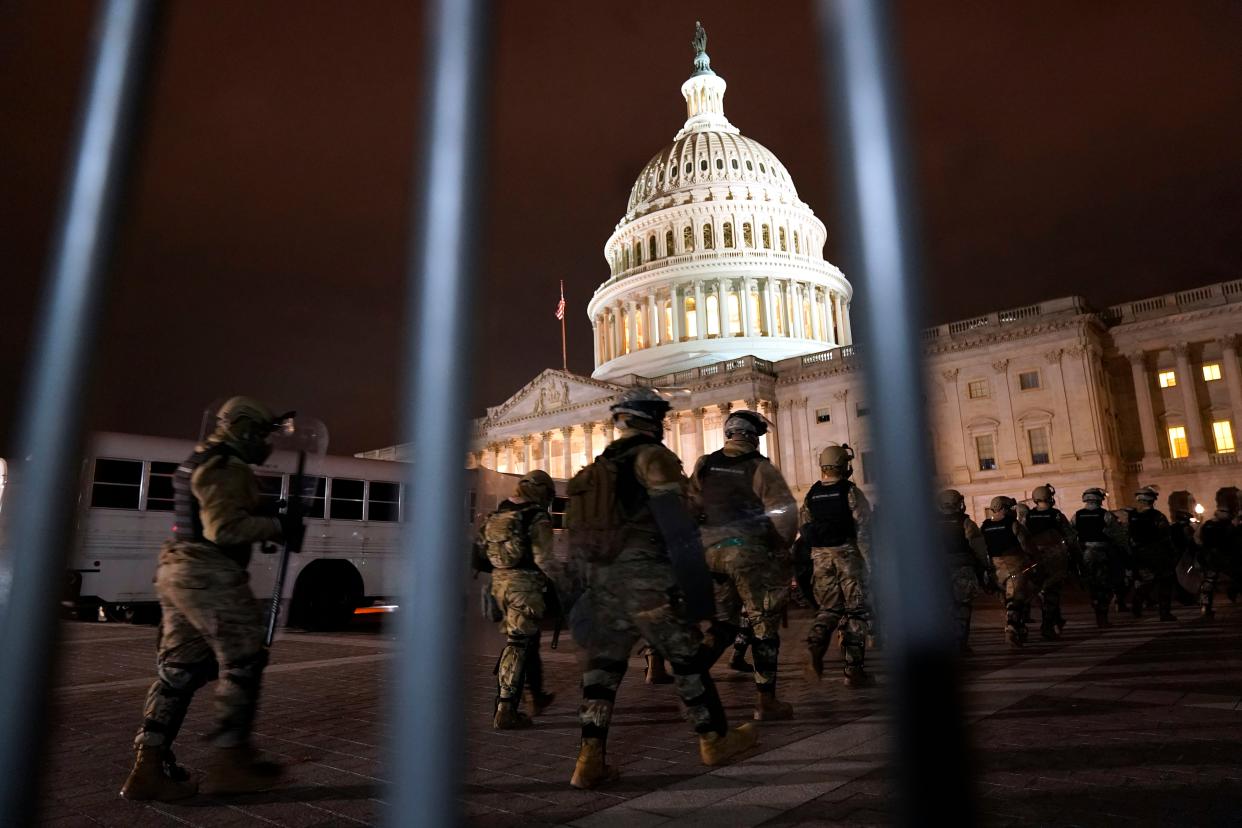 Members of the National Guard arrive to secure the area outside the U.S. Capitol, Wednesday, Jan. 6, 2021, in Washington.