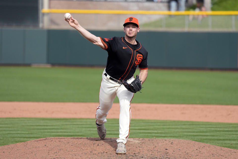 San Francisco Giants pitcher Daulton Jefferies warms up during the fifth inning of a spring training baseball game against the Seattle Mariners Tuesday, Feb. 27, 2024, in Scottsdale, Ariz. Jefferies is trying to come back from a second Tommy John surgery at age 28. (AP Photo/Ross D. Franklin)