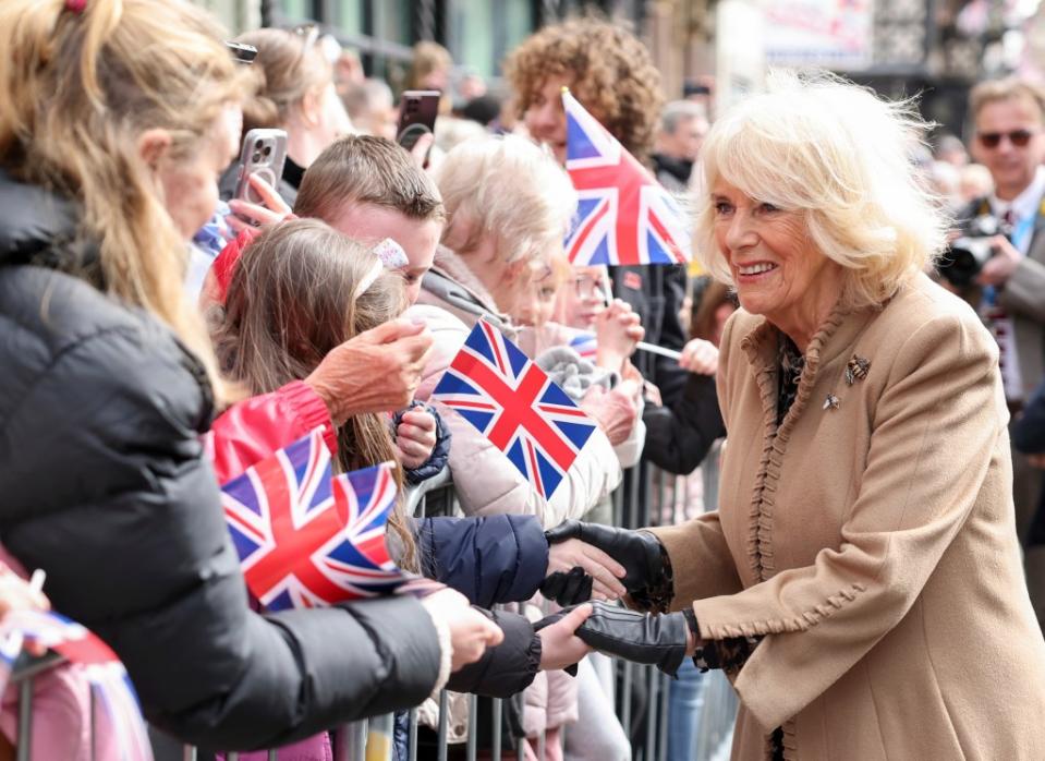 Camilla greeted fans during her outing at a farmers market on Wednesday. AP