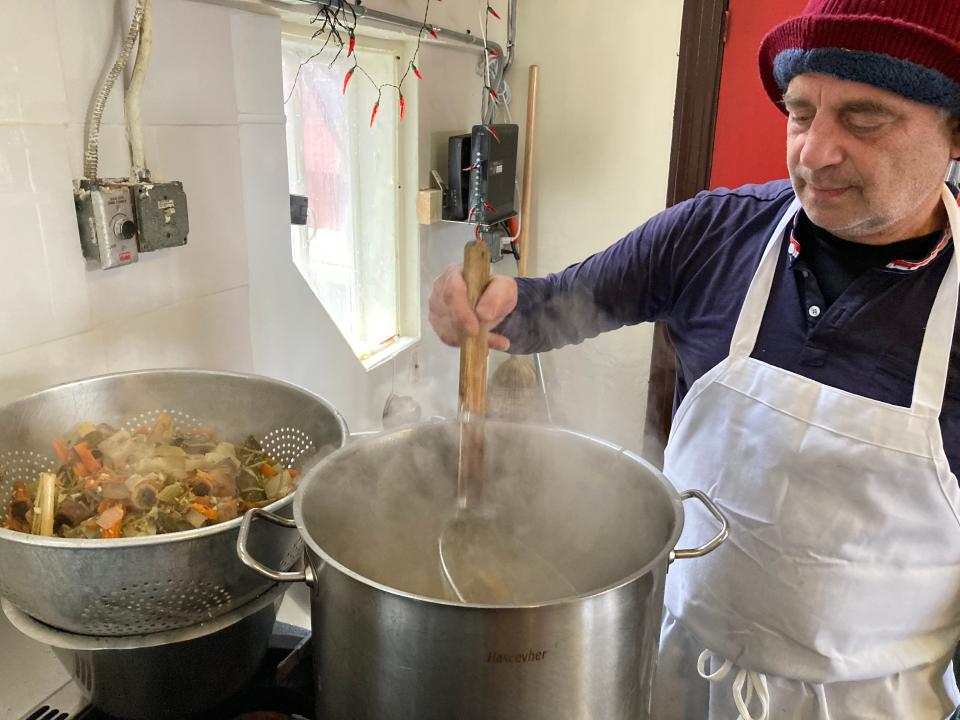 Tim Azarian, co-owner of Wilaiwans, stirs broth at the Montpelier restaurant Nov. 3, 2023.