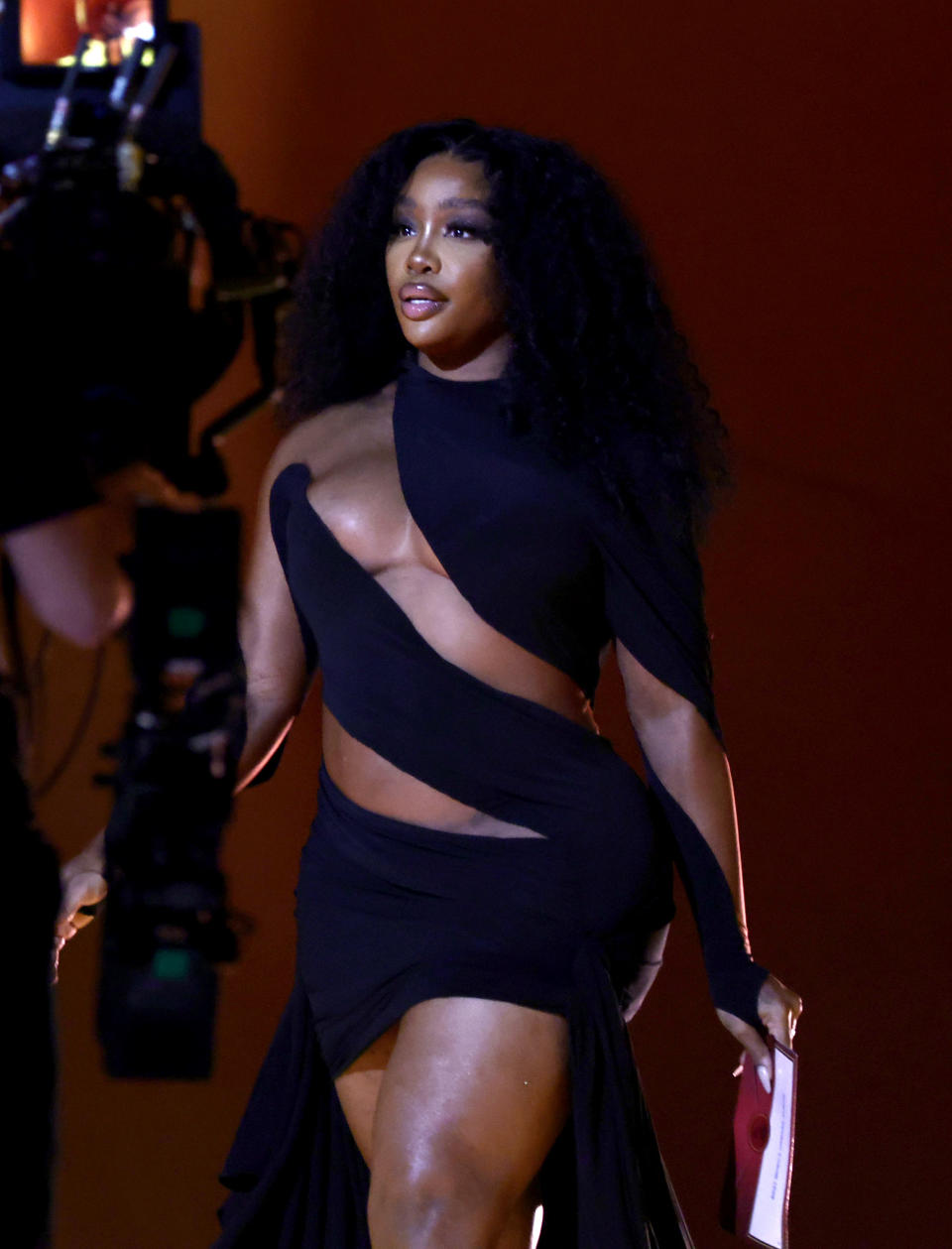 SZA in black cut-out dress