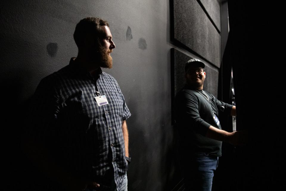 Veterans Memorial auditorium manager Burton Baxter speaks to senior Ludbin Rocha in the black box room at the high school on Tuesday in Corpus Christi.