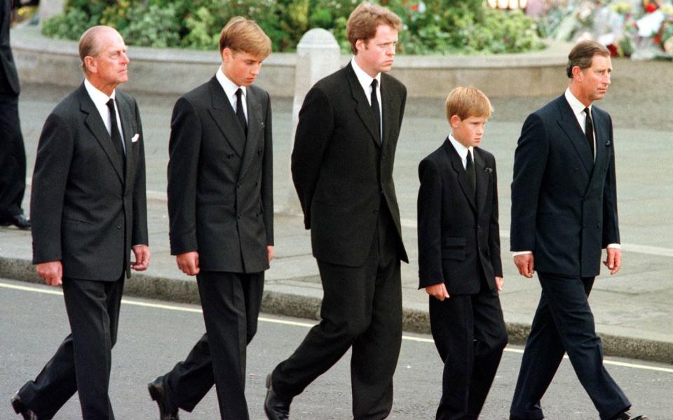 Prince Philip, Prince William, Earl Spencer, Prince Harry and Prince Charles walk behind Diana's coffin  -  JEFF J MITCHELL/ AFP