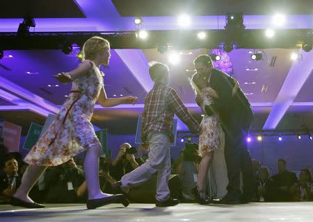 Andrew Scheer is congratulated by his children running onto the stage after he won the leadership during the Conservative Party of Canada leadership convention in Toronto, Ontario, Canada May 27, 2017. REUTERS/Chris Wattie