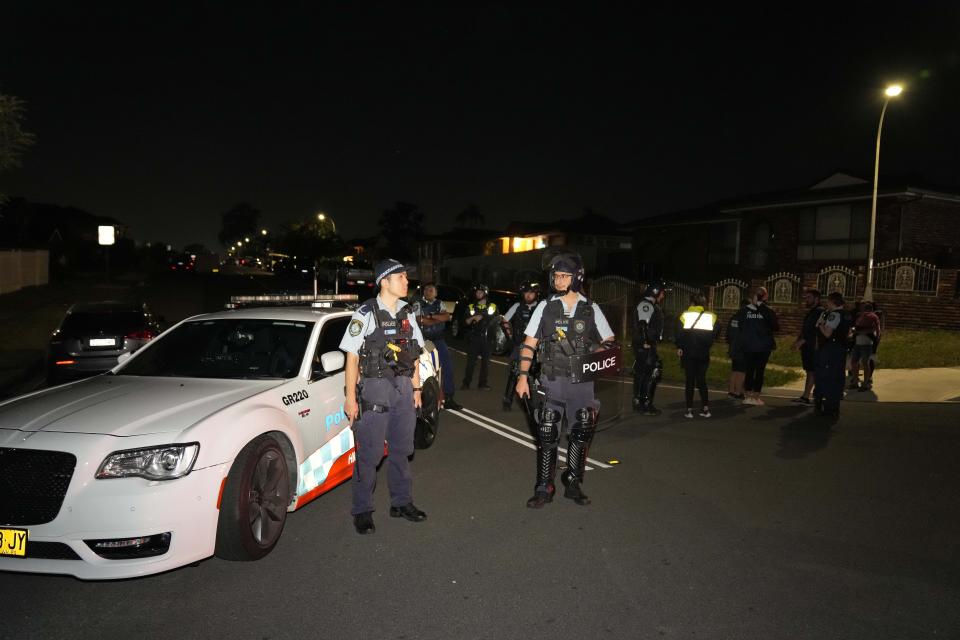 Policeman stand guard outside a church where a bishop and churchgoers were reportedly stabbed in Sydney Australia, Monday, April 15, 2024. (AP Photo/Mark Baker)