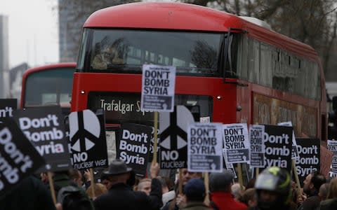 Stop the War protesters block Whitehall outside Downing Street - Credit: AP