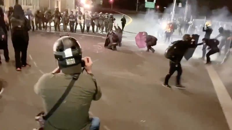 Protesters confront with the police near an Immigration and Customs Enforcement centre in Portland