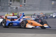 Scott Dixon, of New Zealand, drives into a turn during an IndyCar auto race at Indianapolis Motor Speedway, Friday, Oct. 2, 2020, in Indianapolis. (AP Photo/Darron Cummings)