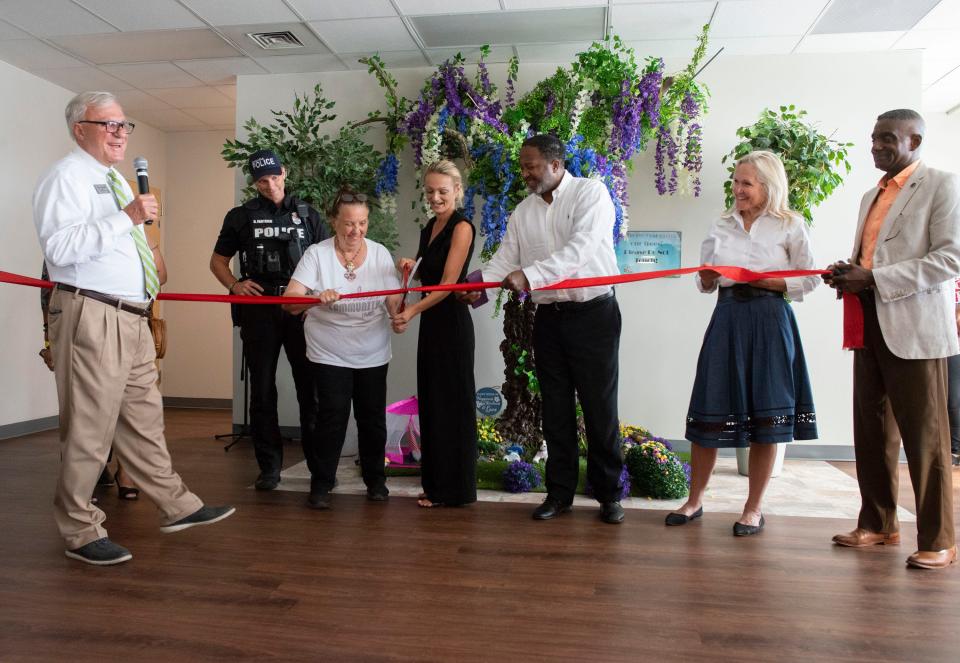 REAP executive Director Vince Whibbs, Jr., and other community partners gather to dedicate the new Max-Well Respite Center on Wednesday, July 27, 2022. Max-Well is Pensacola's latest shelter designed to help the homeless community. 