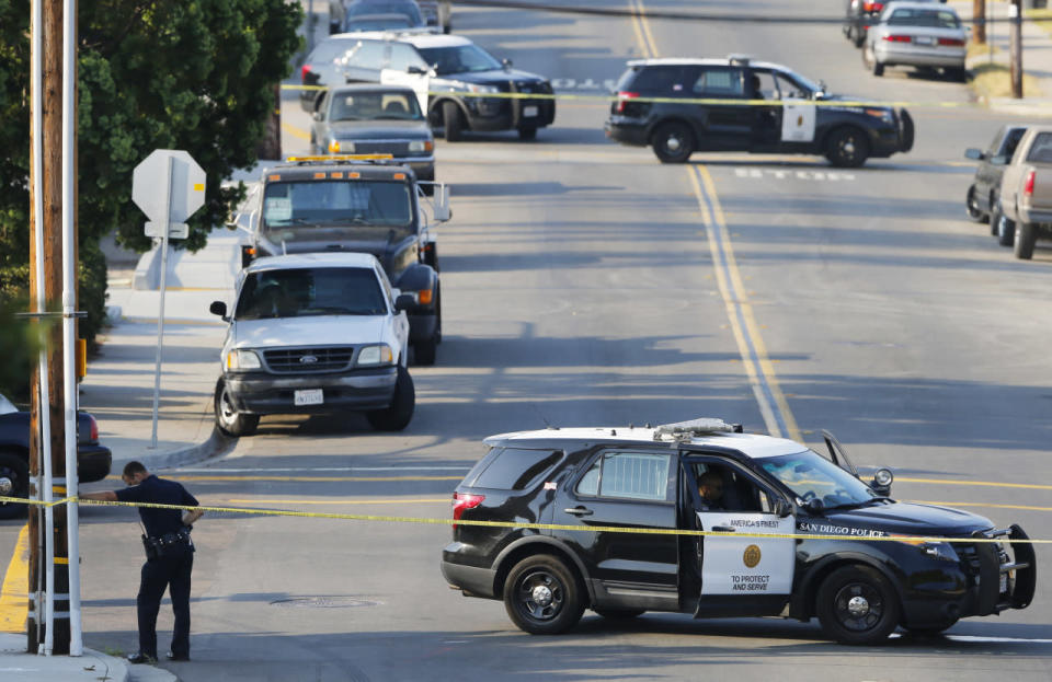 <p>San Diego police officers investigate the scene where an officer was fatally shot and another was injured at a traffic stop, in San Diego, Calif., July 29, 2016. (REUTERS/Mike Blake)</p>