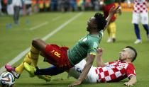 Cameroon's Benjamin Moukandjo (top) is fouled by Croatia's Danijel Pranjic during their 2014 World Cup Group A soccer match at the Amazonia arena in Manaus June 18, 2014. REUTERS/Yves Herman