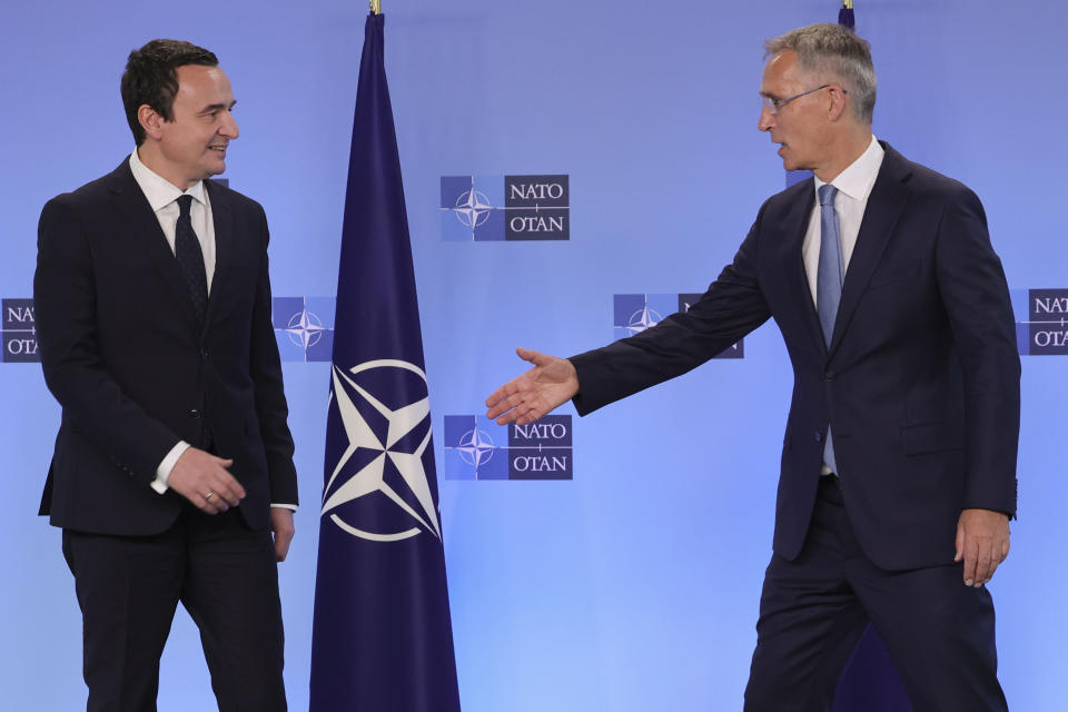 FILE - NATO Secretary General Jens Stoltenberg, right, reaches out to shake hands with Kosovo's Prime Minister Albin Kurti prior to a meeting at NATO headquarters in Brussels, on Aug. 17, 2022. The war in Ukraine has put the European Union's expansion at the top of the agenda as officials from the Western Balkans and EU leaders gather Tuesday for a summit intended to reinvigorate the whole enlargement process. (AP Photo/Olivier Matthys, File)