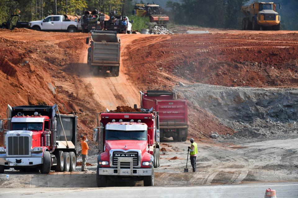 Road construction crews remove dirt at the site of the McWright’s Ferry Rd. Extension near where it will join the Eastern Northern Bypass at Rice Mine Rd. In Tuscaloosa Tuesday, Sept. 12, 2023.