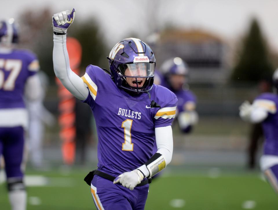 Williamsville's Nolan Bates celebrates after he and the defense stopped Tolono Unity on 4th down giving the game to Williamsville in the last minute of the game. 