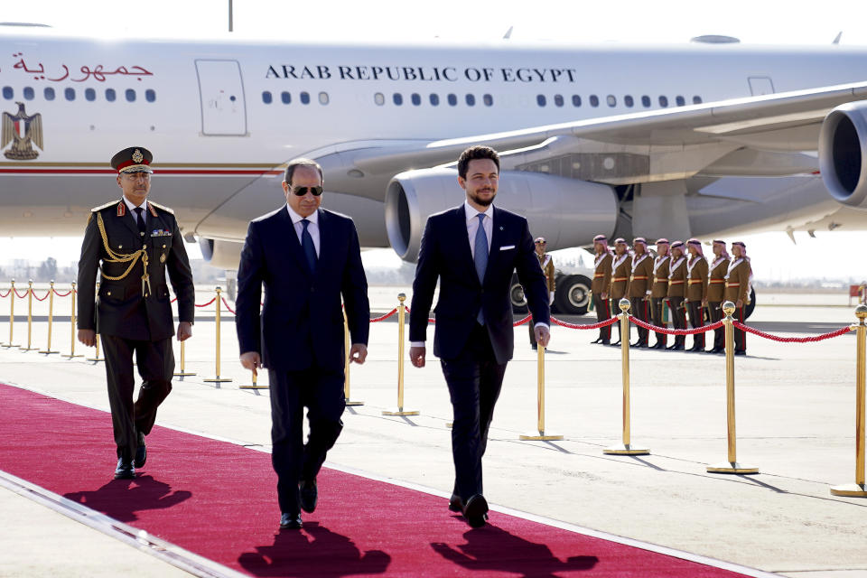 Jordan's Crown Prince Hussein and Egyptian President Abdel Fattah El-Sisi walk at the airport in Amman, Jordan, Tuesday, Dec. 20, 2022. Leaders from the Middle East and Europe gathered in Jordan Tuesday in a conference focused on bolstering security and stability in Iraq. (The Royal Hashemite Court via AP)
